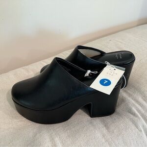 a new day black clogs